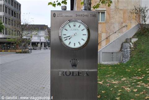 Rolex clock on a steel column in a city square