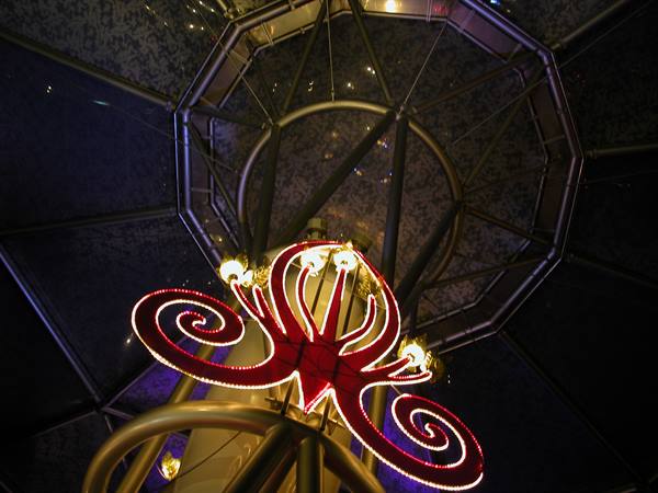 Red spiral light sculpture beneath the glass dome of Victoria Square, Belfast