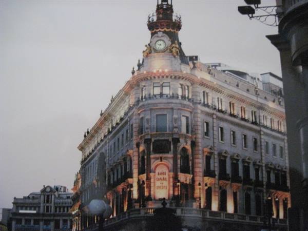 Historic corner building with clock and lit dome, Gran Vía, Madrid