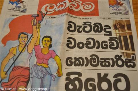 Sinhala-language newspaper with illustration of workers raising hammer and sickle