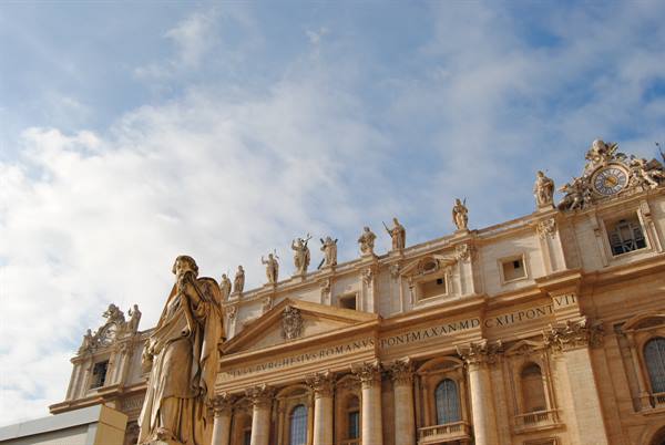 Apostle statue in front of the baroque facade of St. Peter's, Vatican