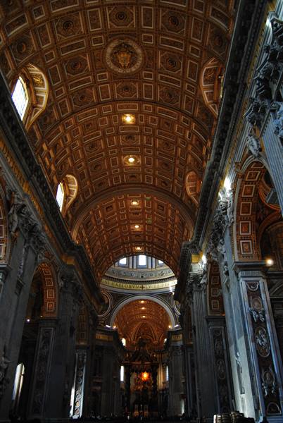 Golden coffered ceiling of St. Peter's Basilica, light through windows