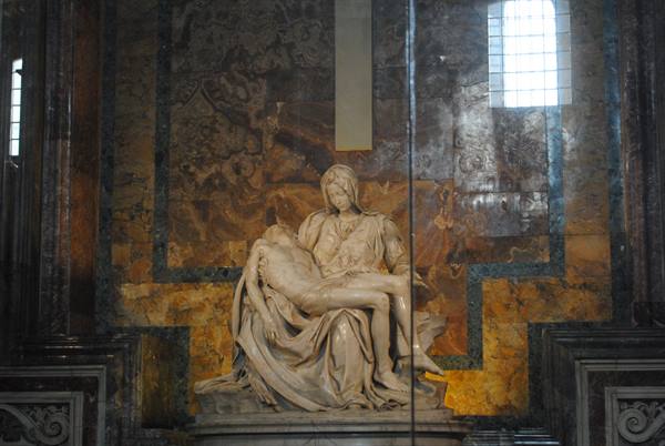 Michelangelo's marble Pietà behind protective glass in St Peter's