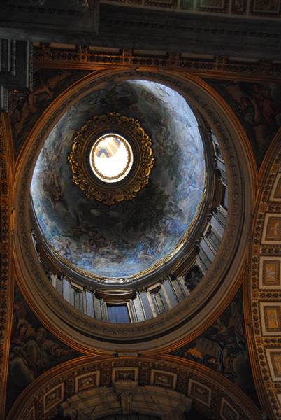 Frescoed dome with gilded lantern, light streaming through the church oculus