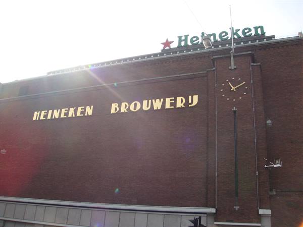 Heineken Brouwerij brick facade with golden sign and clock