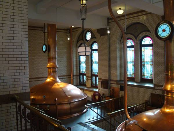 Historic Heineken brewery hall: copper kettles and stained glass, Amsterdam