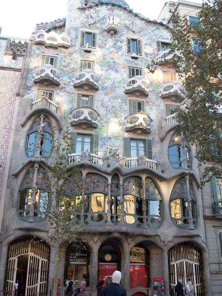 The facade of Casa Batlló in Barcelona with tourists at the entrance