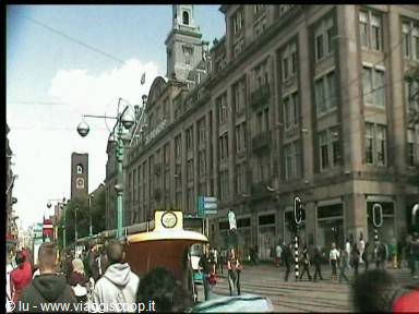Crowd of pedestrians in front of the Madame Tussauds building, Amsterdam