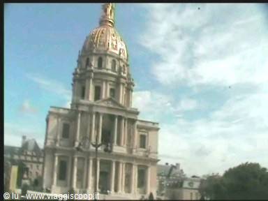 The golden dome of Les Invalides in Paris, pale stone under cloudy sky