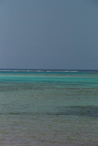 Turquoise reef waters under grey sky, Red Sea