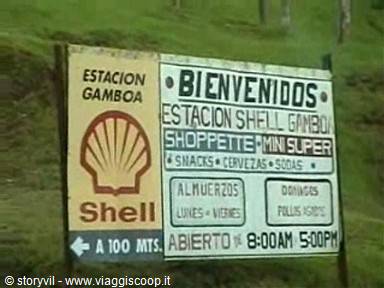 Shell sign for Gamboa station by the roadside, green background