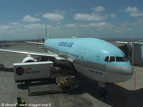 Korean Air plane parked at the airport, LSG Sky Chefs truck loading meals