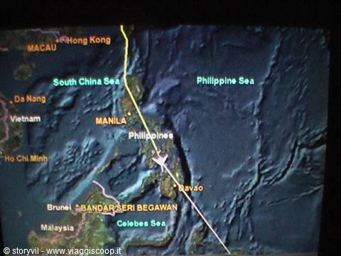 Screen showing South China Sea map with flight route toward the Philippines