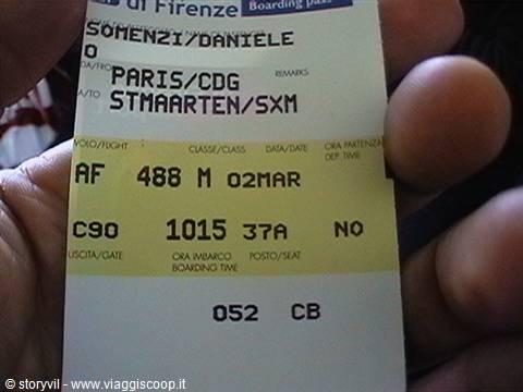 Air France boarding pass for Paris and Saint Martin held in hand