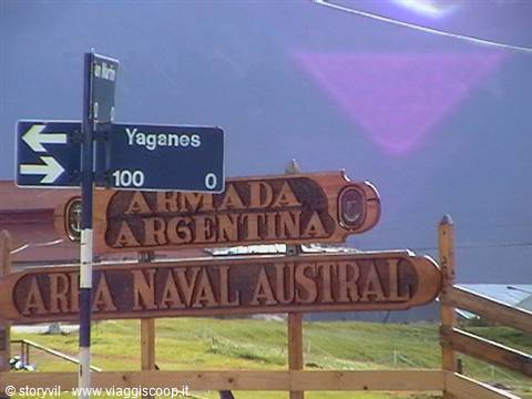Yaganes street sign and wooden Armada Argentina signboard