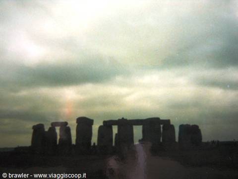 Stonehenge: standing megaliths under a grey cloudy sky