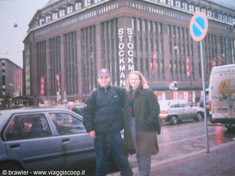 Couple standing in front of the Stockmann department store in Helsinki