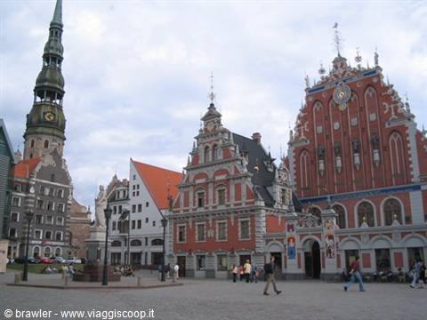 Riga, Town Hall Square: the House of the Blackheads beside St. Peter's tower