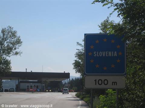 Blue EU road sign: Slovenia 100 m ahead at the border crossing