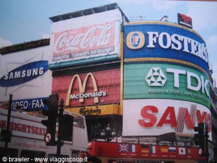 Piccadilly Circus, London: bright Coca-Cola, McDonald's and TDK billboards above a red bus