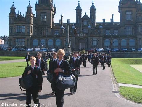 Students in uniform carrying sports bags outside Fettes College, Edinburgh