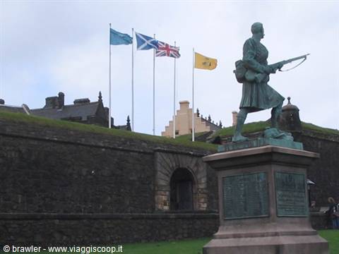 Bronze statue of a soldier with rifle before Stirling Castle walls