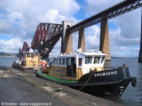 The tugboat Drumsand moored beneath the Forth Bridge in Scotland