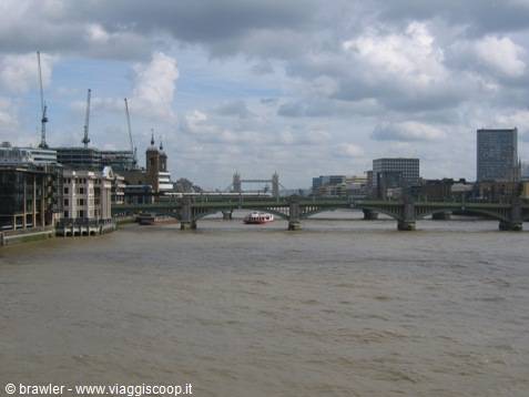 The Thames in London with Tower Bridge in the background and a railway bridge