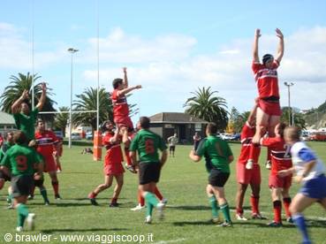 Rugby match: red and green players lifting in a lineout