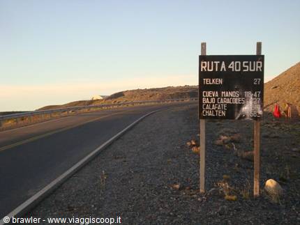 Wooden milestone sign on Ruta 40 Sur near Télken, Patagonia, warm light