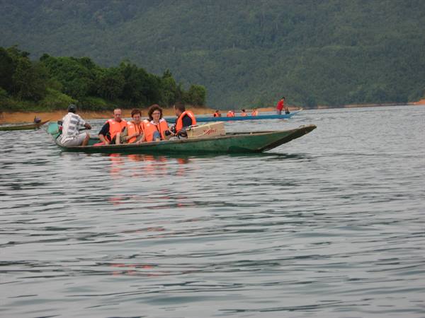 by boat towards the longhouses