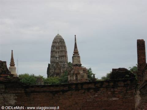 Ancient brick stupas and stone pagodas rise above the ruins of Ayutthaya