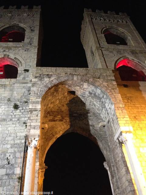 The two medieval towers of Porta Soprana in Genoa lit at night
