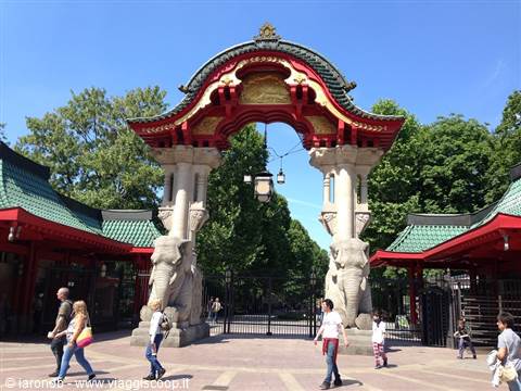 Elephant Gate at Berlin Zoo, red arches and green roofs, visitors walk by