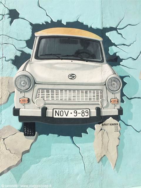 Mural of a white Trabant bursting through the wall, East Side Gallery, Berlin