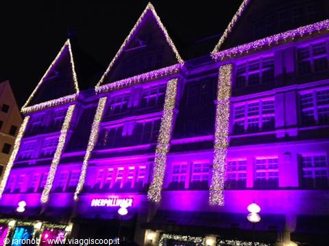 Gothic-style facade lit in purple with Christmas lights, Diepholzer sign