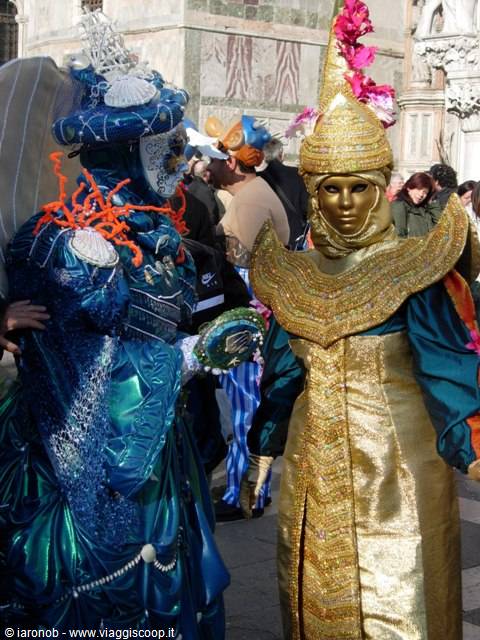 Blue and gold carnival masks at Venice Carnival in St Mark's Square