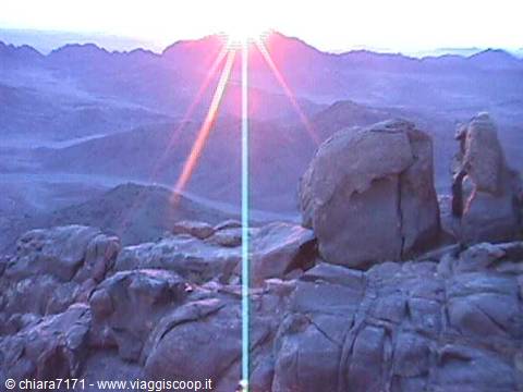 Sunrise over Mount Sinai, golden light between granite rocks