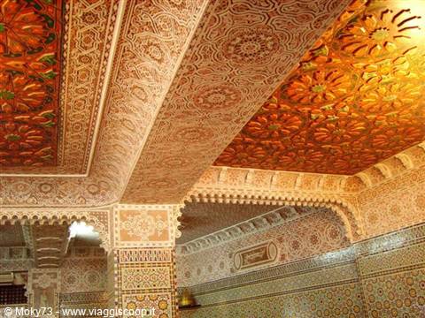 Carved cedar wood and stucco ceiling of Telouet Kasbah, warm golden light