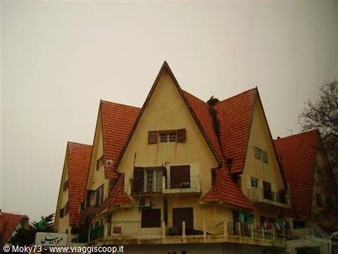 Red-tiled roofs and ochre walls in Ifrane, Morocco's alpine-style town