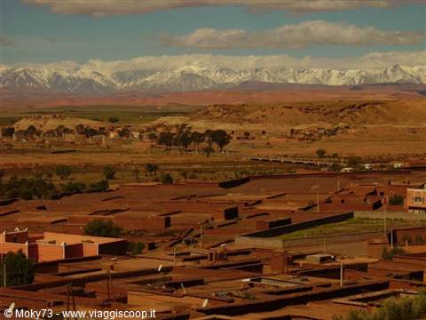 Ouarzazate earthen rooftops with the snow-capped Atlas mountains behind