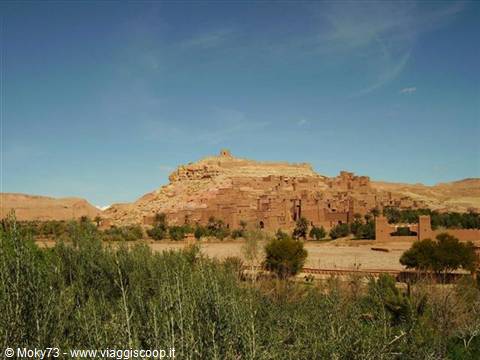 Aït Benhaddou village, red mud-brick houses among palms and greenery
