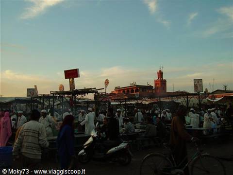 Jemaa el-Fna square in Marrakech, crowd among food stalls at dusk