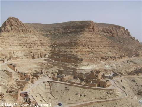 Berber stone village beneath ochre cliffs, Chenini