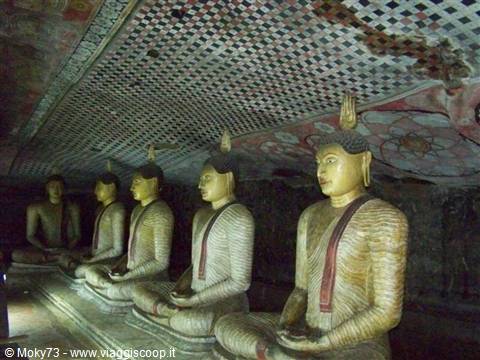 Seated Buddha statues inside the Dambulla rock temple