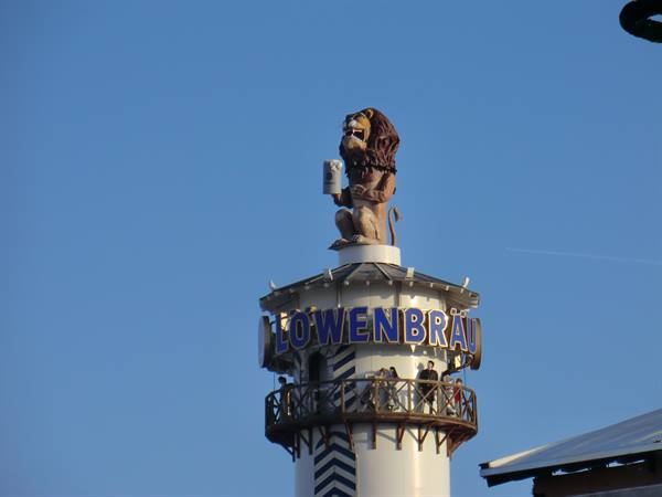 Löwenbräu tower with lion raising a beer stein, Oktoberfest, Munich