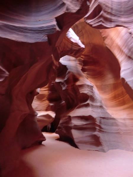 Antelope Canyon: wavy red sandstone walls lit by filtered light