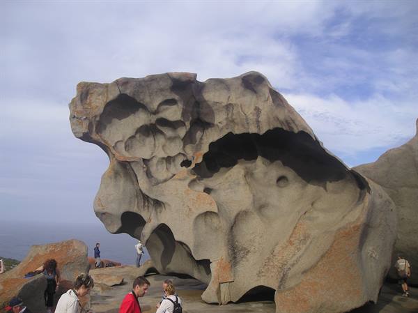 Tourists beneath the eroded granite sculpture of Remarkable Rocks, Kangaroo Island