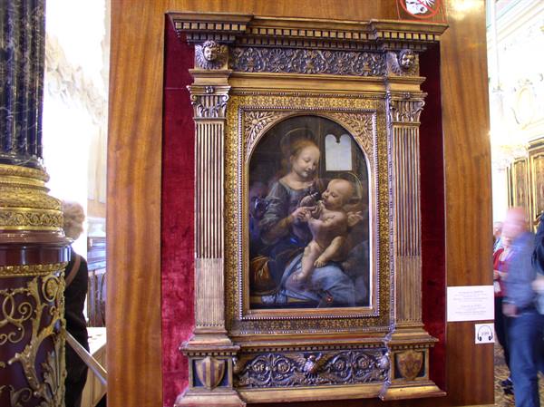 Leonardo's Madonna Litta in gilded frame on red velvet, Hermitage