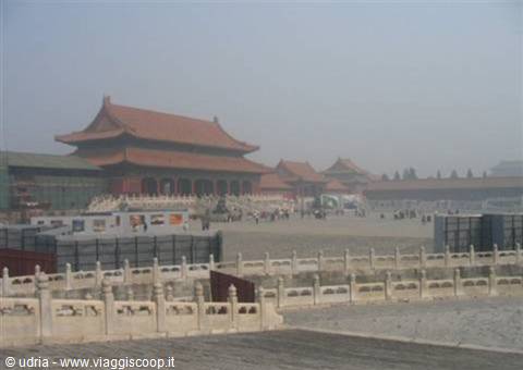 Red-roofed pavilion in Beijing's Forbidden City under haze